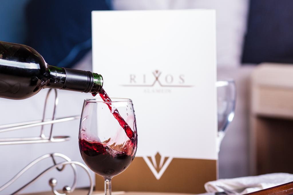 Rixos Alamein - Full Board Plus El Alamein Luaran gambar Wine being poured into a wine glass