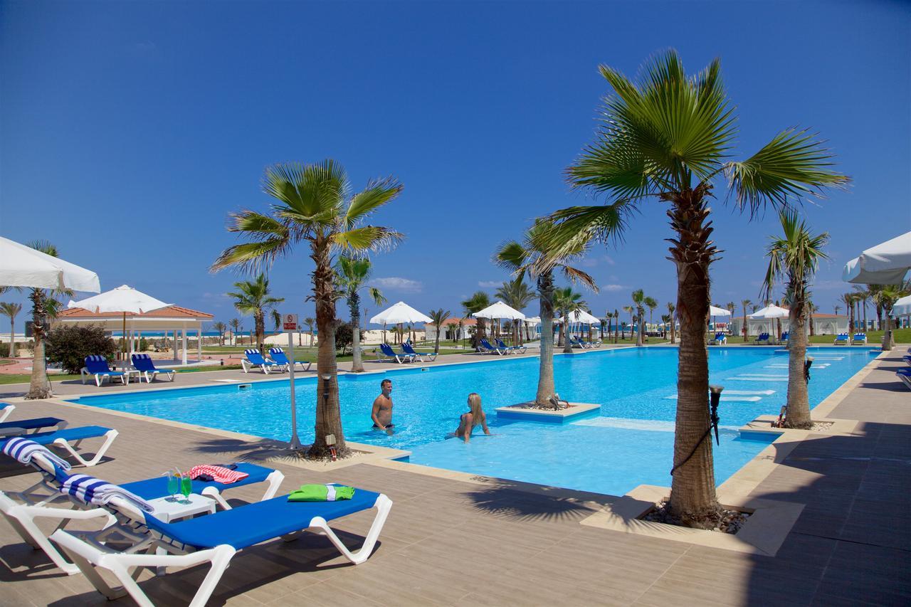 Rixos Alamein - Full Board Plus El Alamein Luaran gambar A swimming pool in a hotel